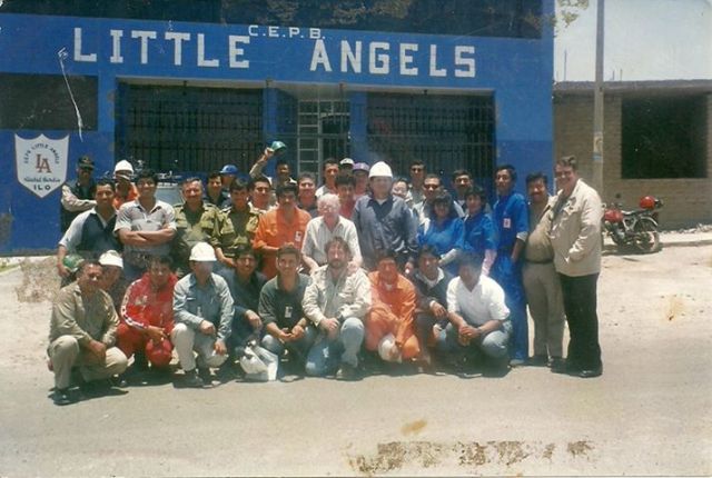 Members of the Ilo Rescue Team, in front of the Chisholm Family School; "Little Angels'.