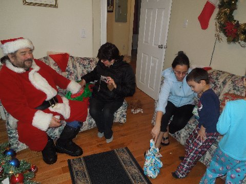 Mrs Claus helps Santa deliver presents to good little boys and girls.